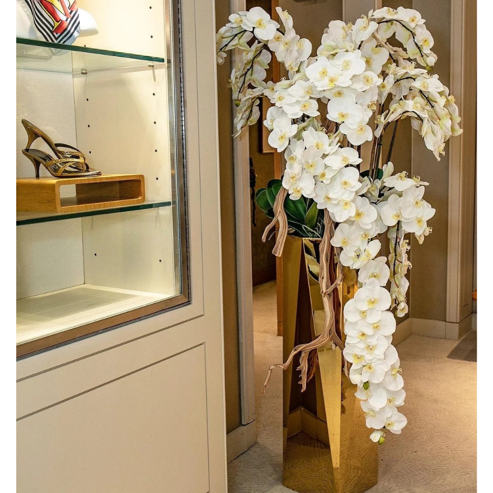 Kaskaden-Orchideen im Goldenen Prism Topf